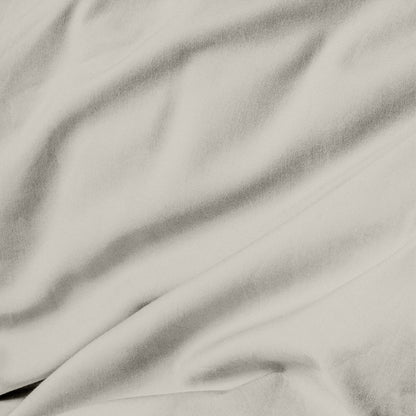 Close-up of cream fabric with folds
